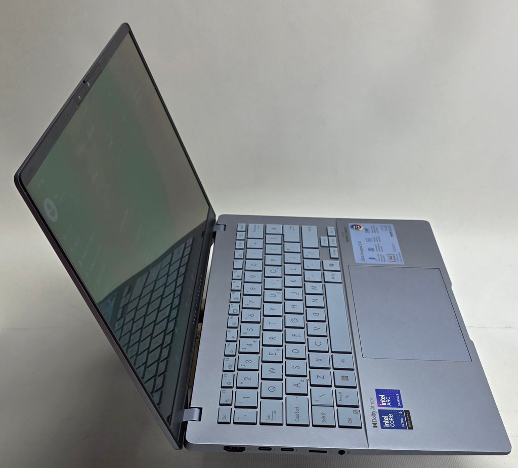 Open laptop on a white surface