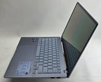 Open laptop on a white surface