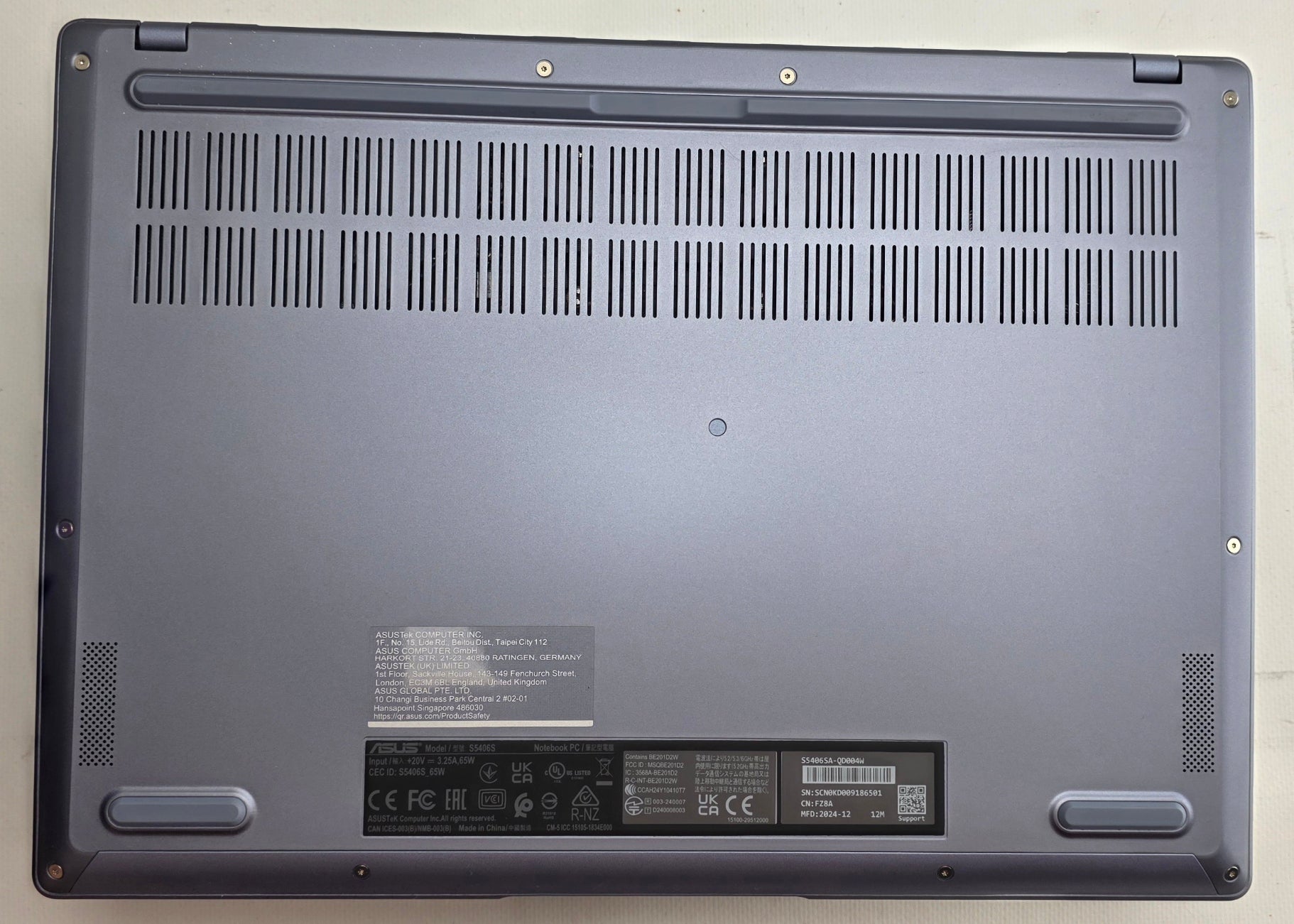Back view of a laptop on a light gray background