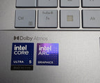 Intel Core and Intel Arc graphics stickers on a laptop keyboard