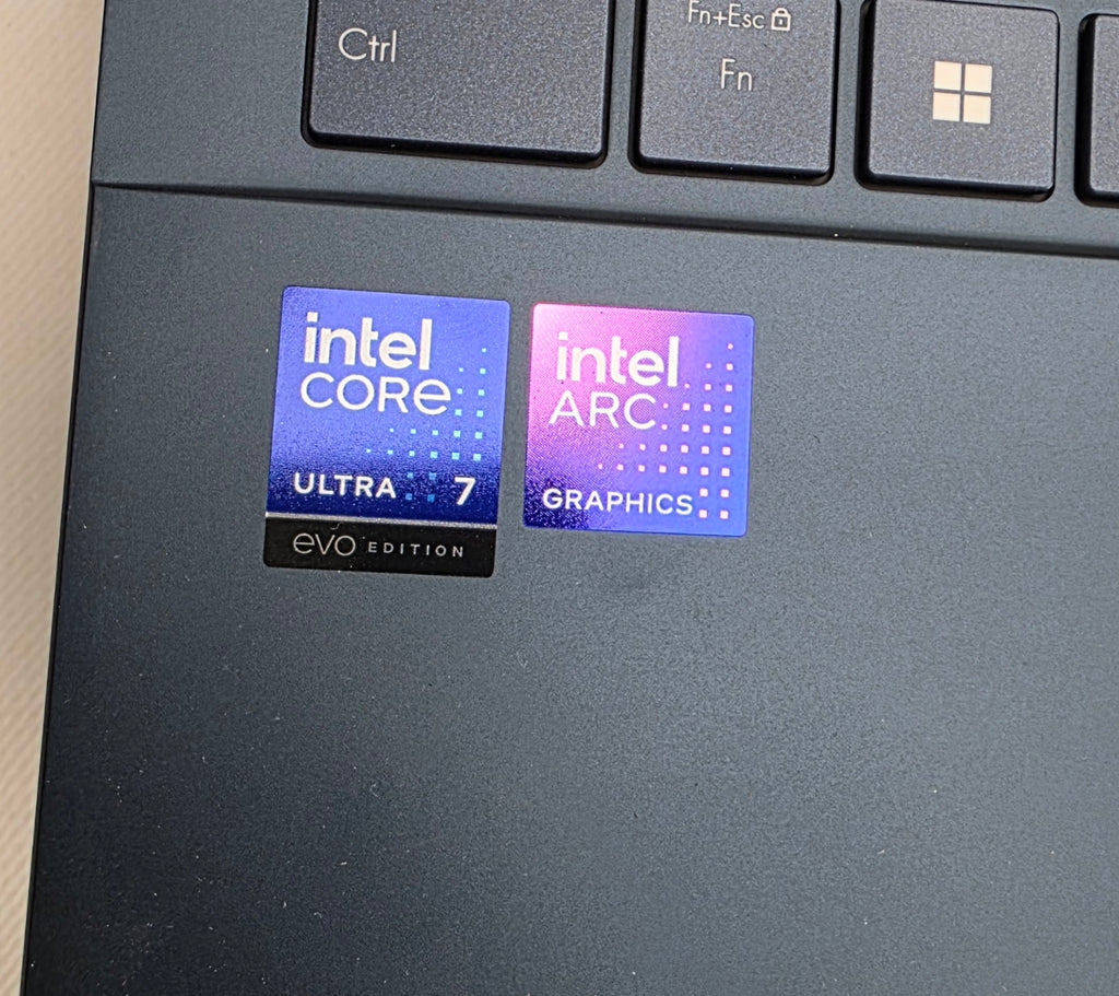 Intel Core and Intel Arc graphics stickers on a laptop
