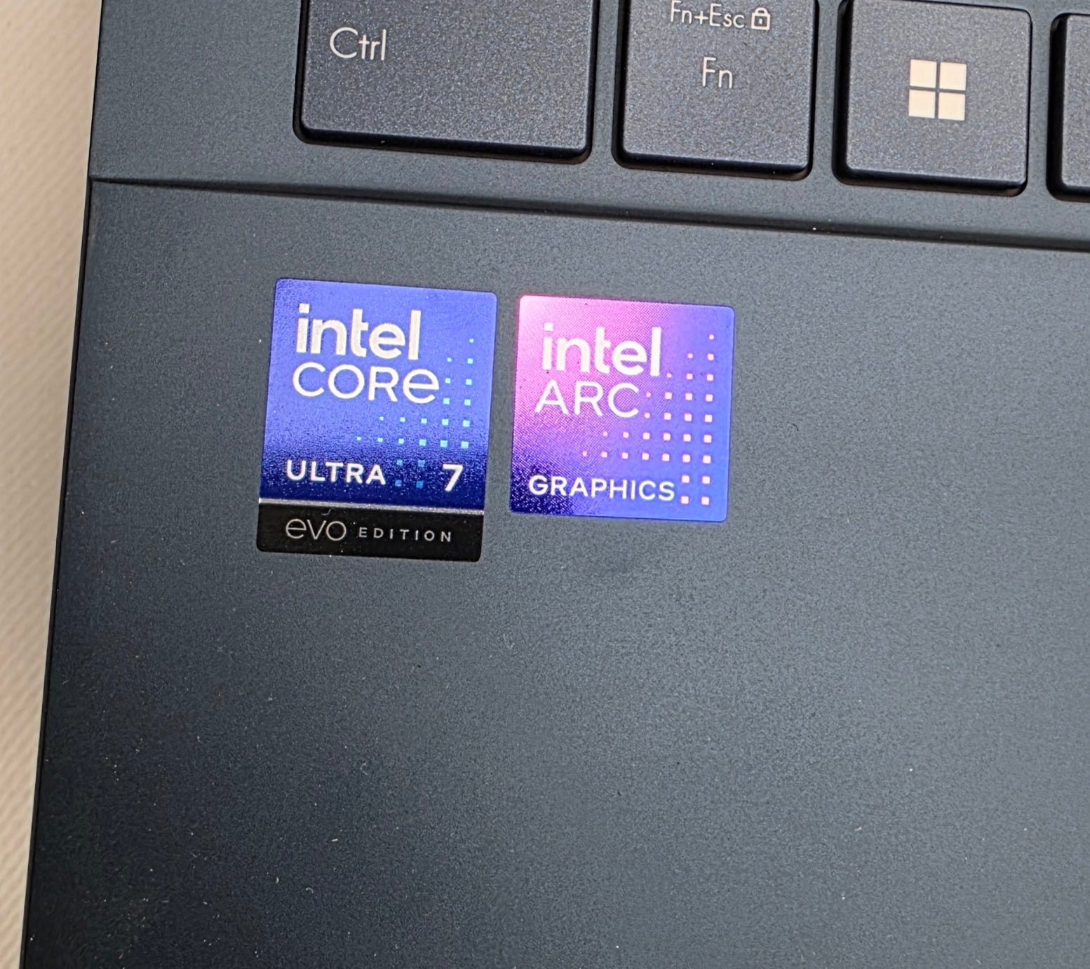 Intel Core and Intel Arc graphics stickers on a laptop