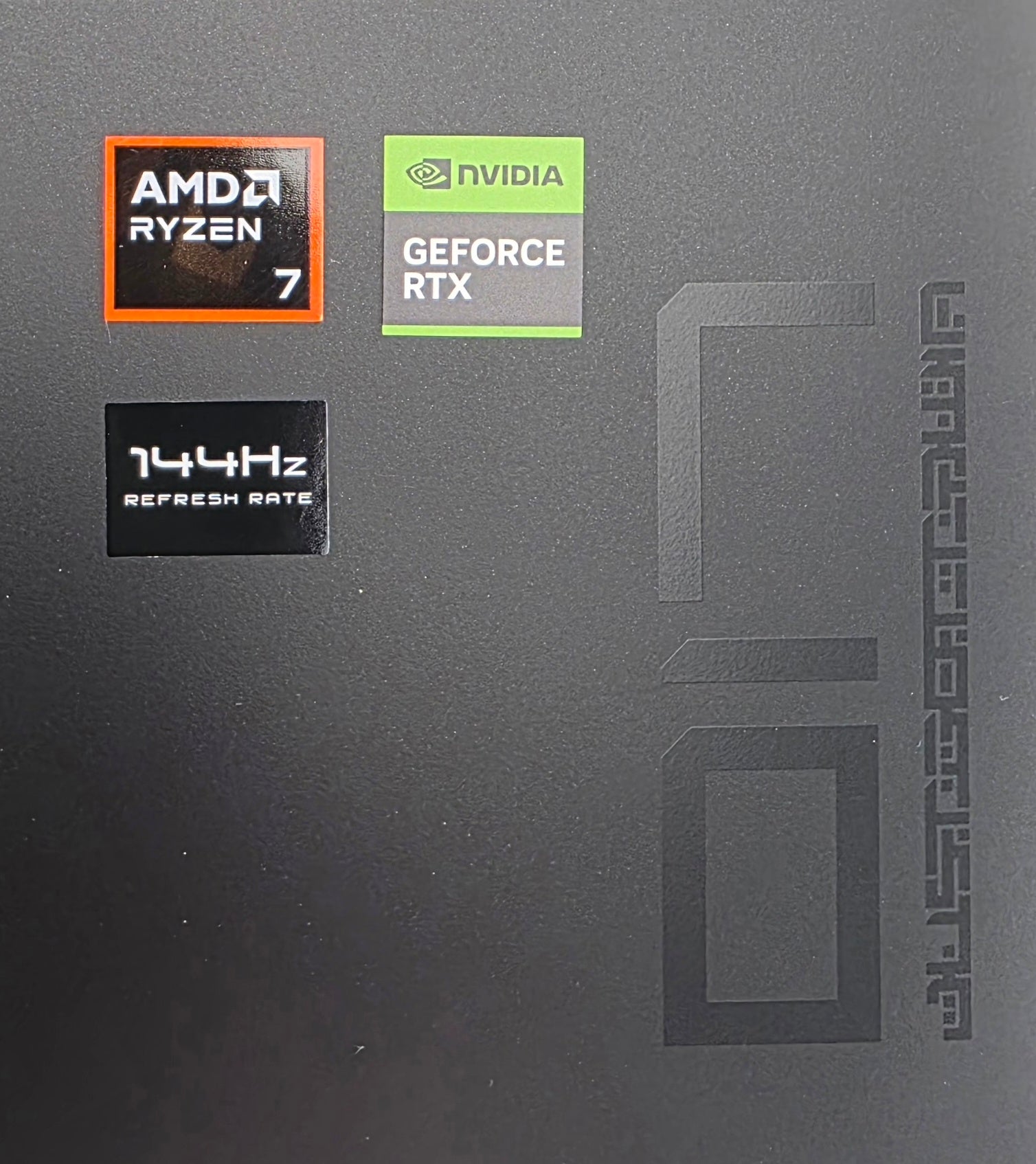Computer case with AMD Ryzen 7, NVIDIA GeForce RTX, and 144Hz refresh rate stickers.