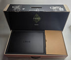 Black laptop in an open box with 'OMEN' branding on a gray background