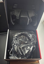 Gaming headset inside a black box with clear plastic cover