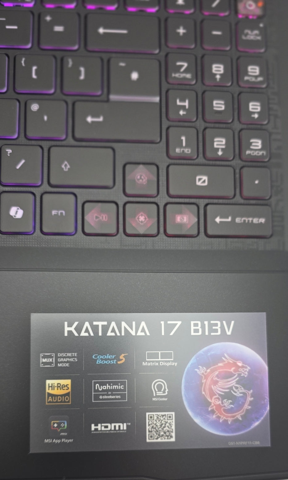 Close-up of a laptop keyboard with 'KATANA 17 B13V' branding on the screen.