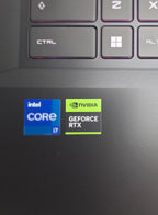 Close-up of a laptop keyboard with Intel Core i7 and NVIDIA GeForce RTX logos.